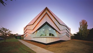 The cladding is LYSAGHT CUSTOM ORB® profile made from COLORBOND® steel in the colours Axis® and Conservatory®, which alternate vertically on the northern face.